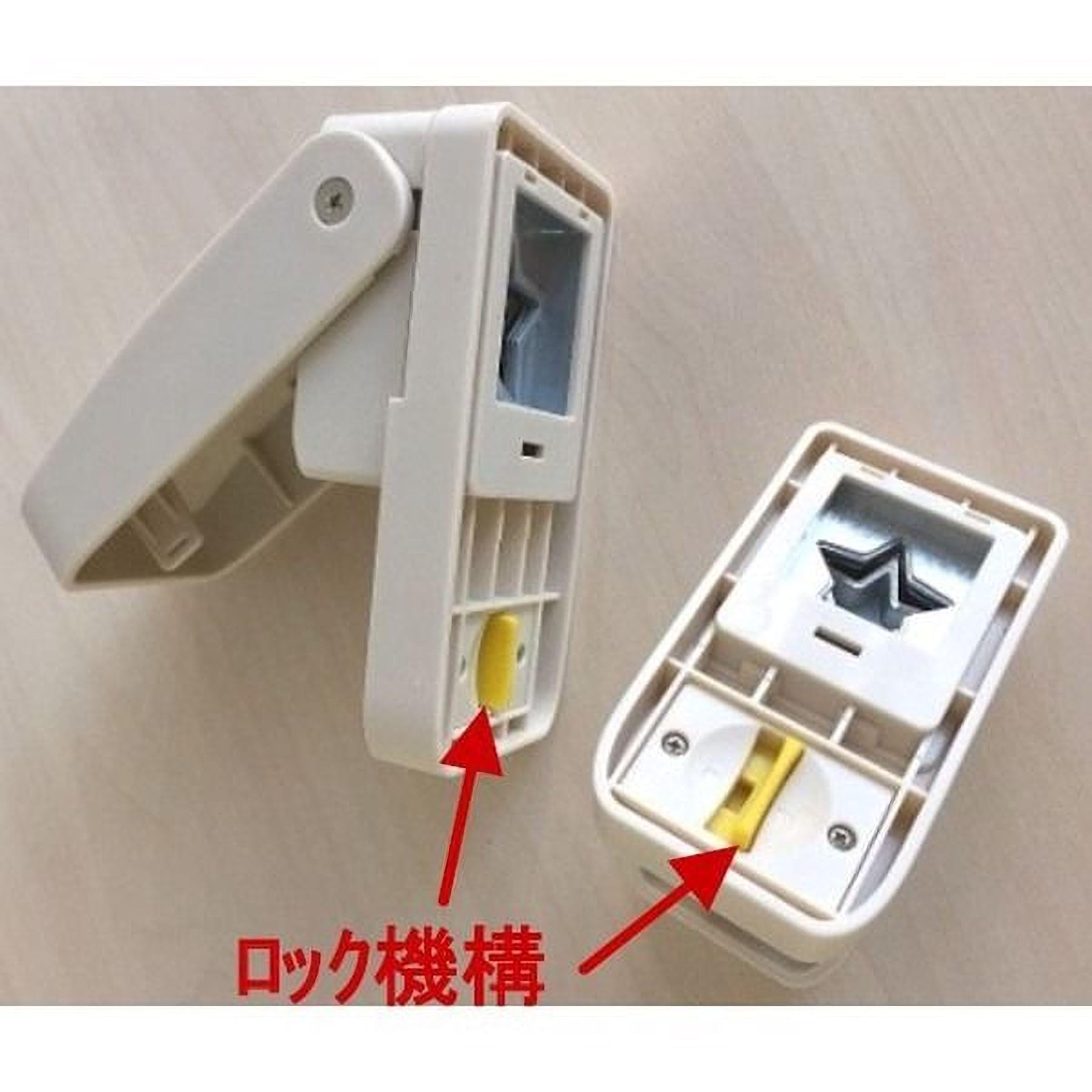 two white plastic devices with yellow and red buttons, one of which is open, and there is Japanese text in the image.