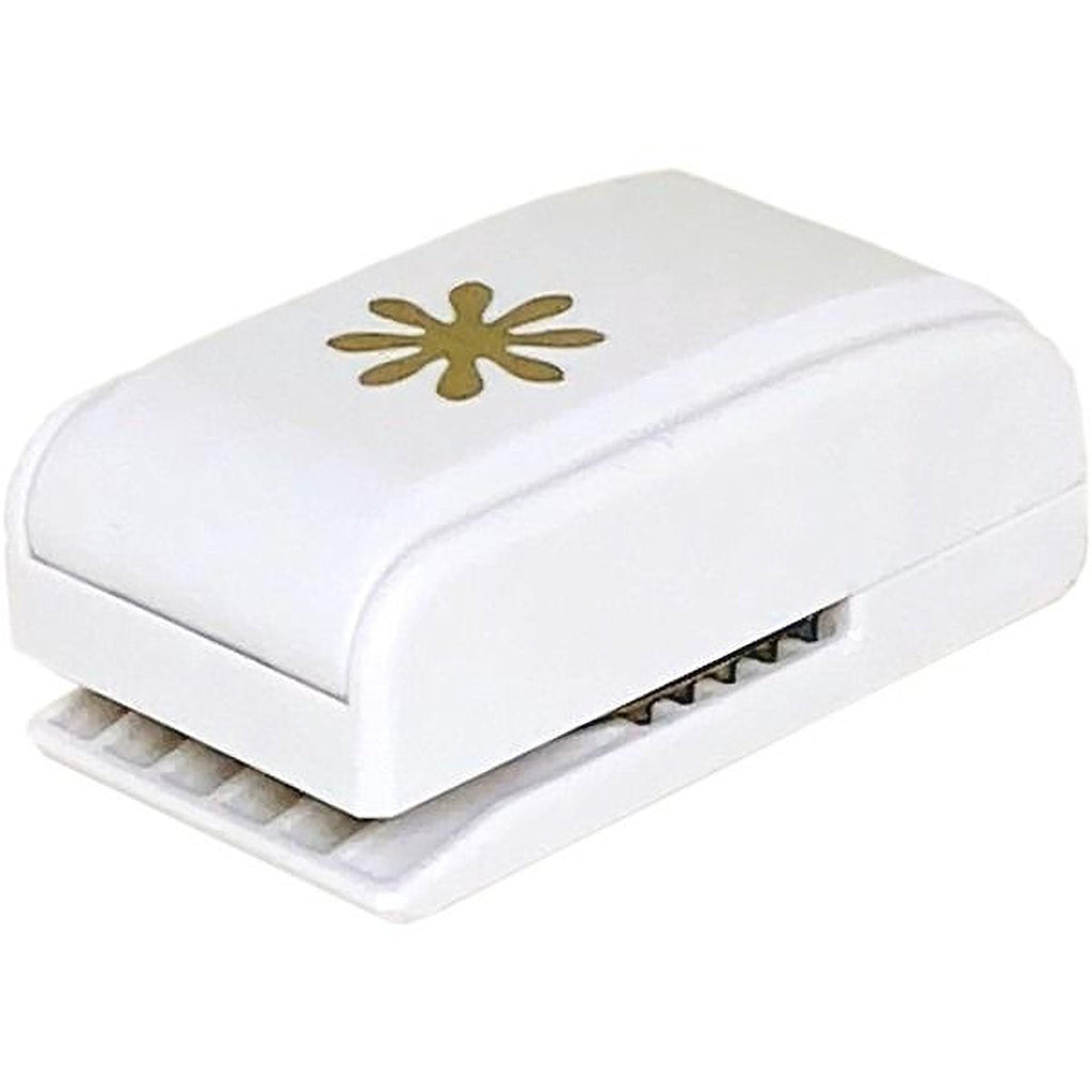 A white, rectangular paper puncher with a gold star design on the top surface.