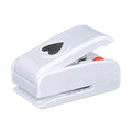A white plastic hole puncher with a heart-shaped hole on the top.