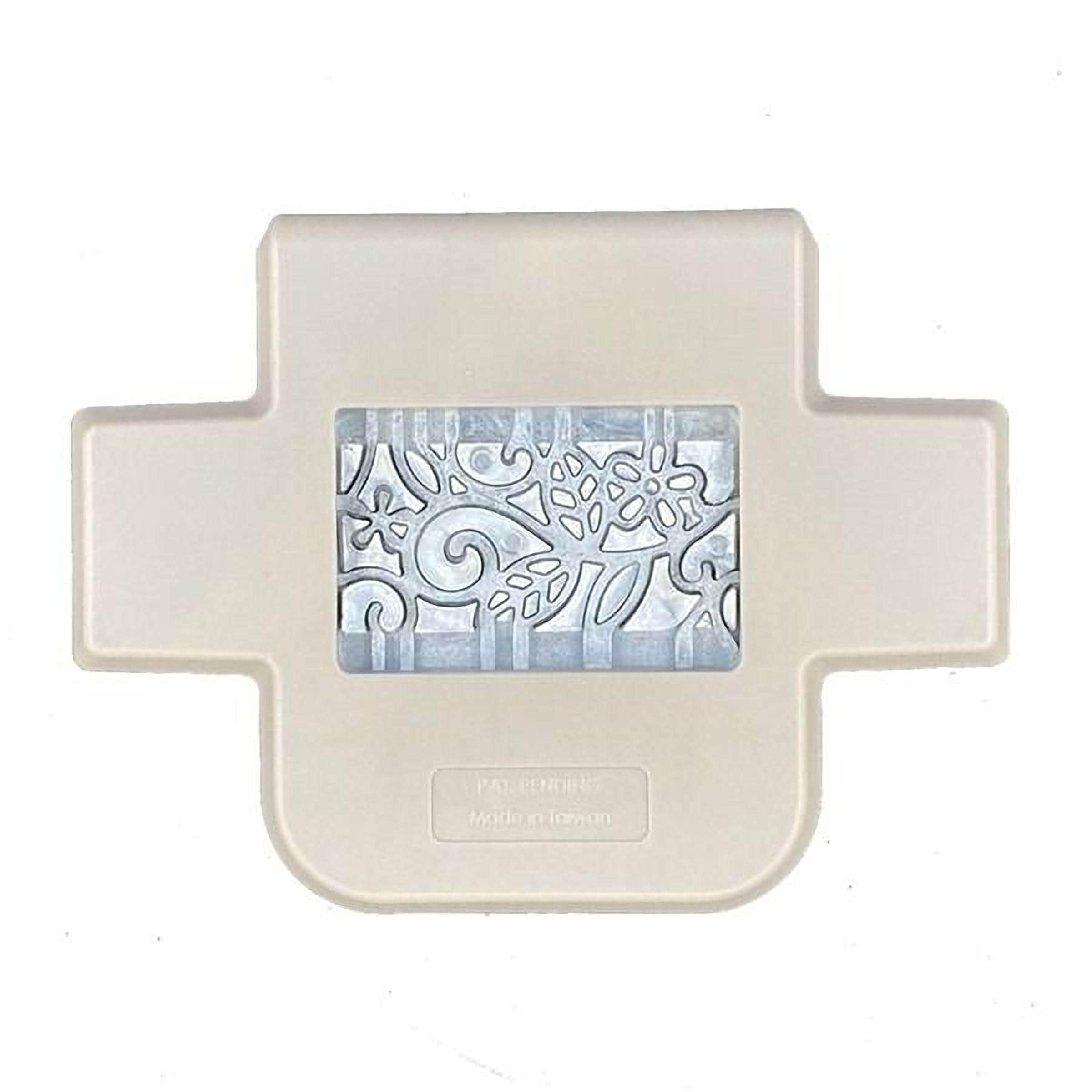 A beige plastic container with a decorative pattern on its front.