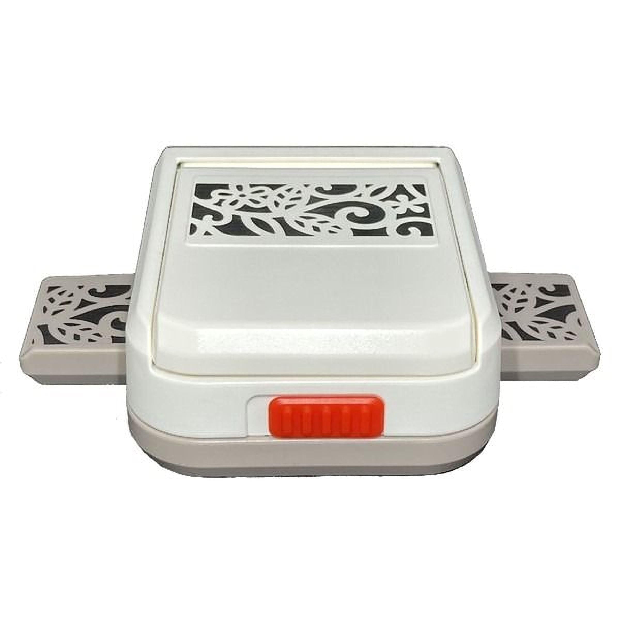 A white and gray plastic punch or cutter with a decorative pattern on the top surface.