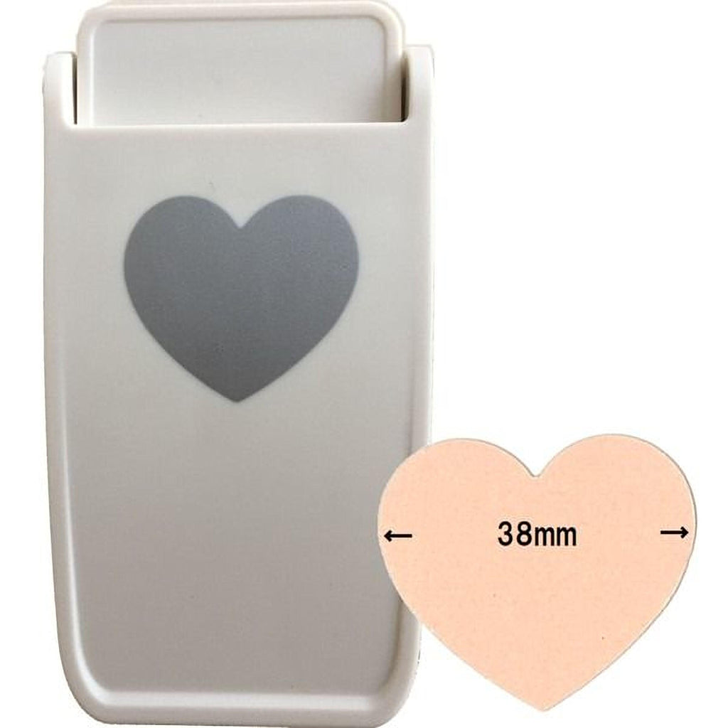 a white heart-shaped object with a gray heart symbol on it, along with a smaller heart-shaped object that measures 38mm in size.
