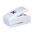 A white plastic hole puncher with a butterfly design on it.