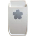 A white plastic object with a gray flower-shaped design on it.