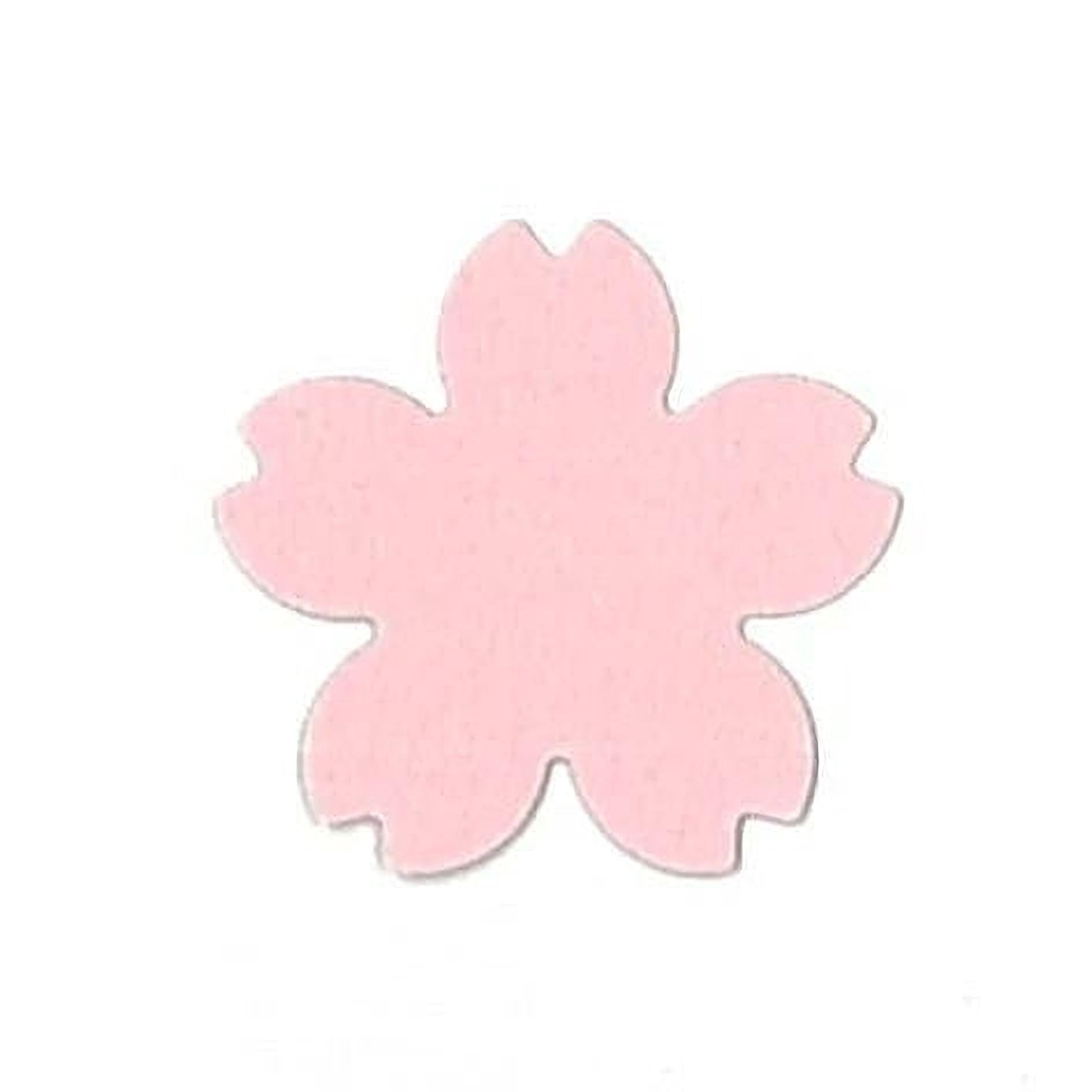 A single pink paper flower shape against a white background.