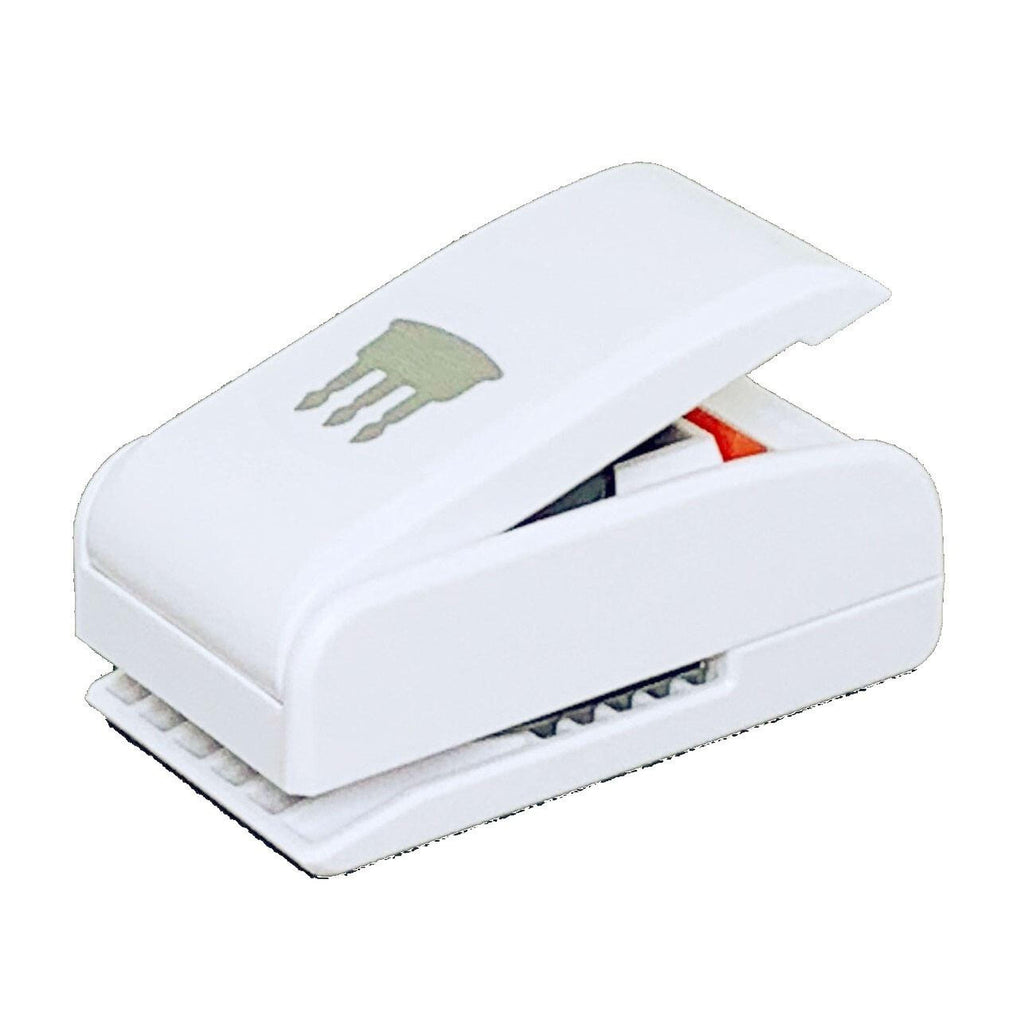 A white stapler with a green design on it.