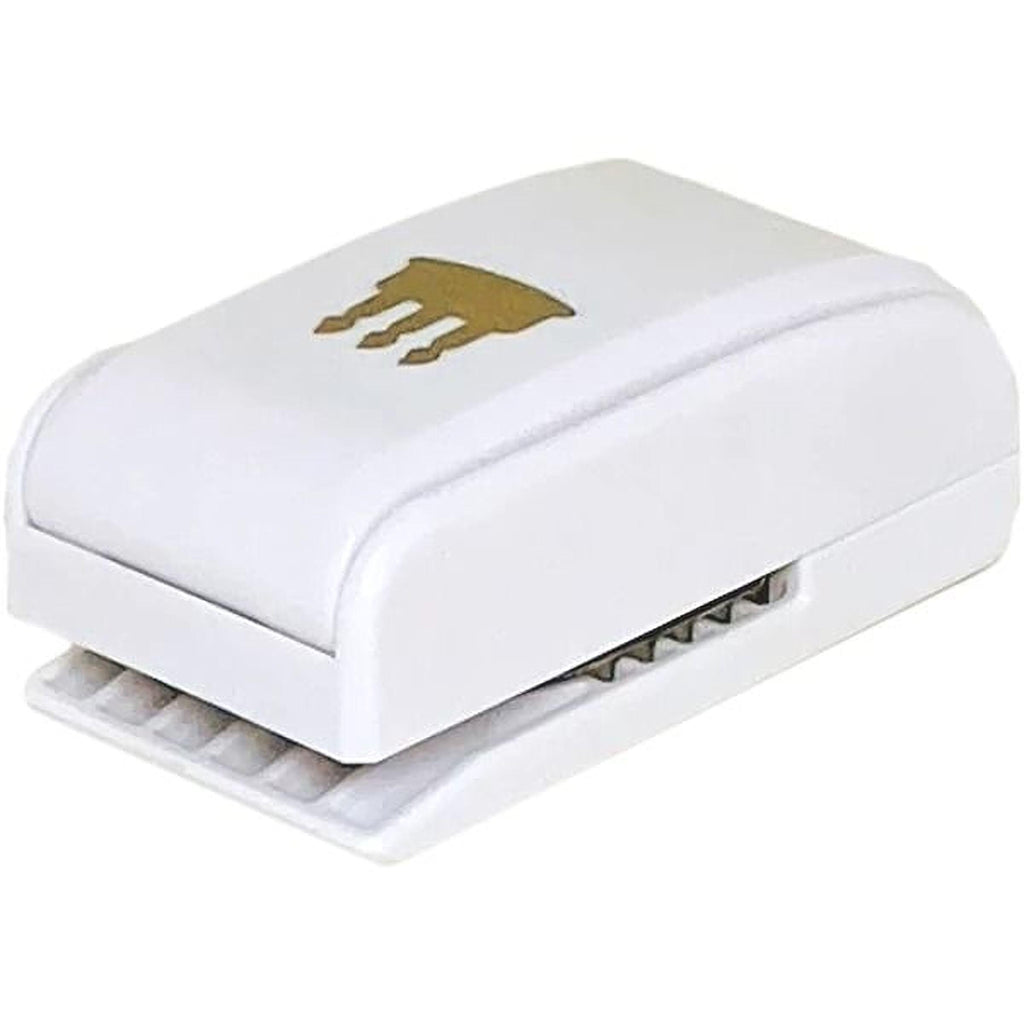 A white paper puncher with a gold crown design on it.