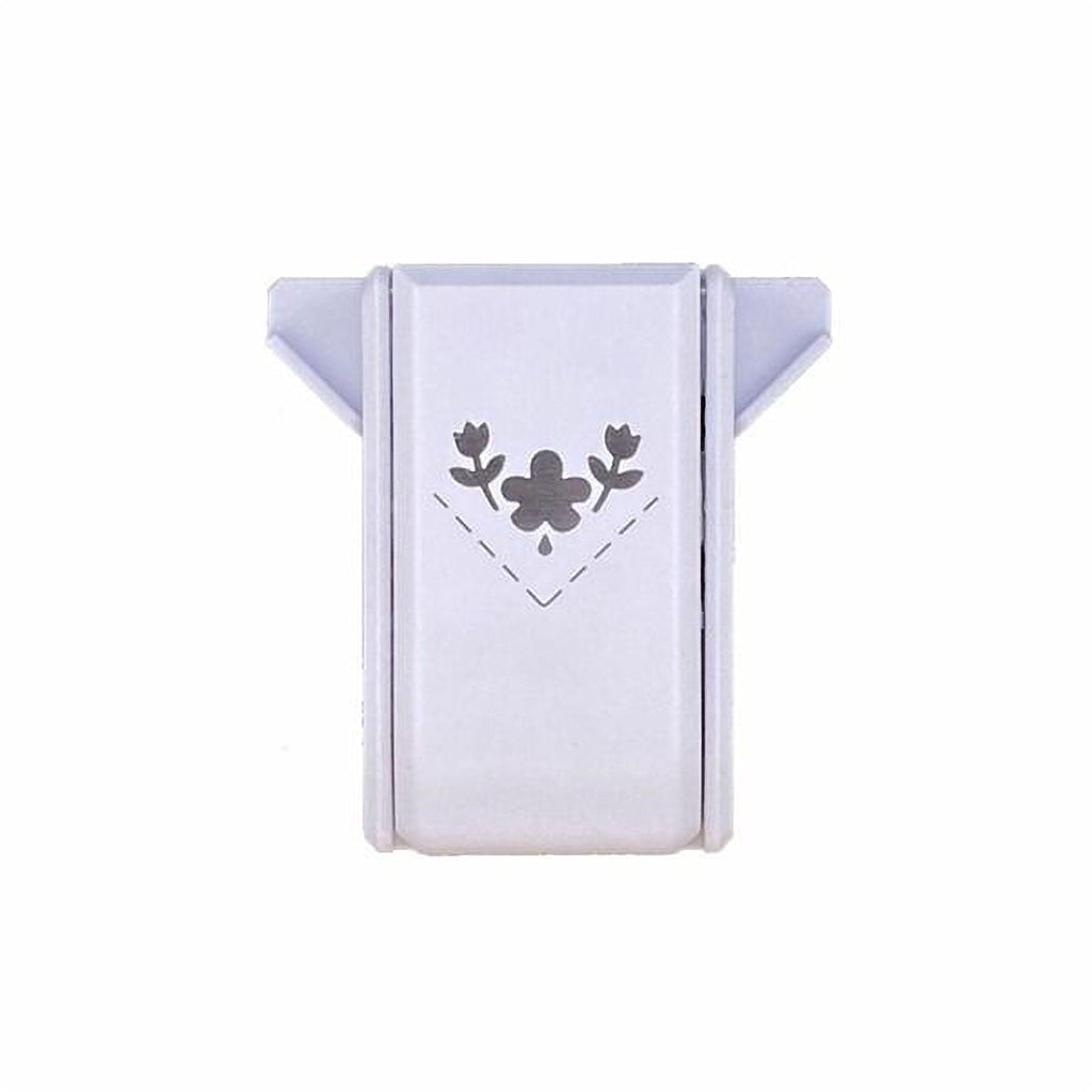 A white, rectangular object with a black floral design on it.