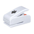 A white plastic hole puncher with a black clover design on it.