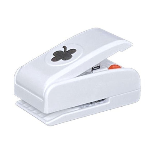 A white plastic hole puncher with a black clover design on it.