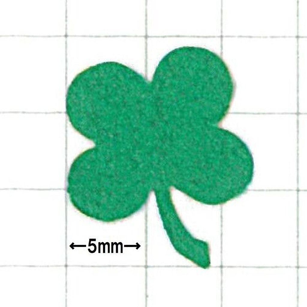 A green clover-shaped object is shown against a grid background, with a scale indicating it is 5 millimeters in size.