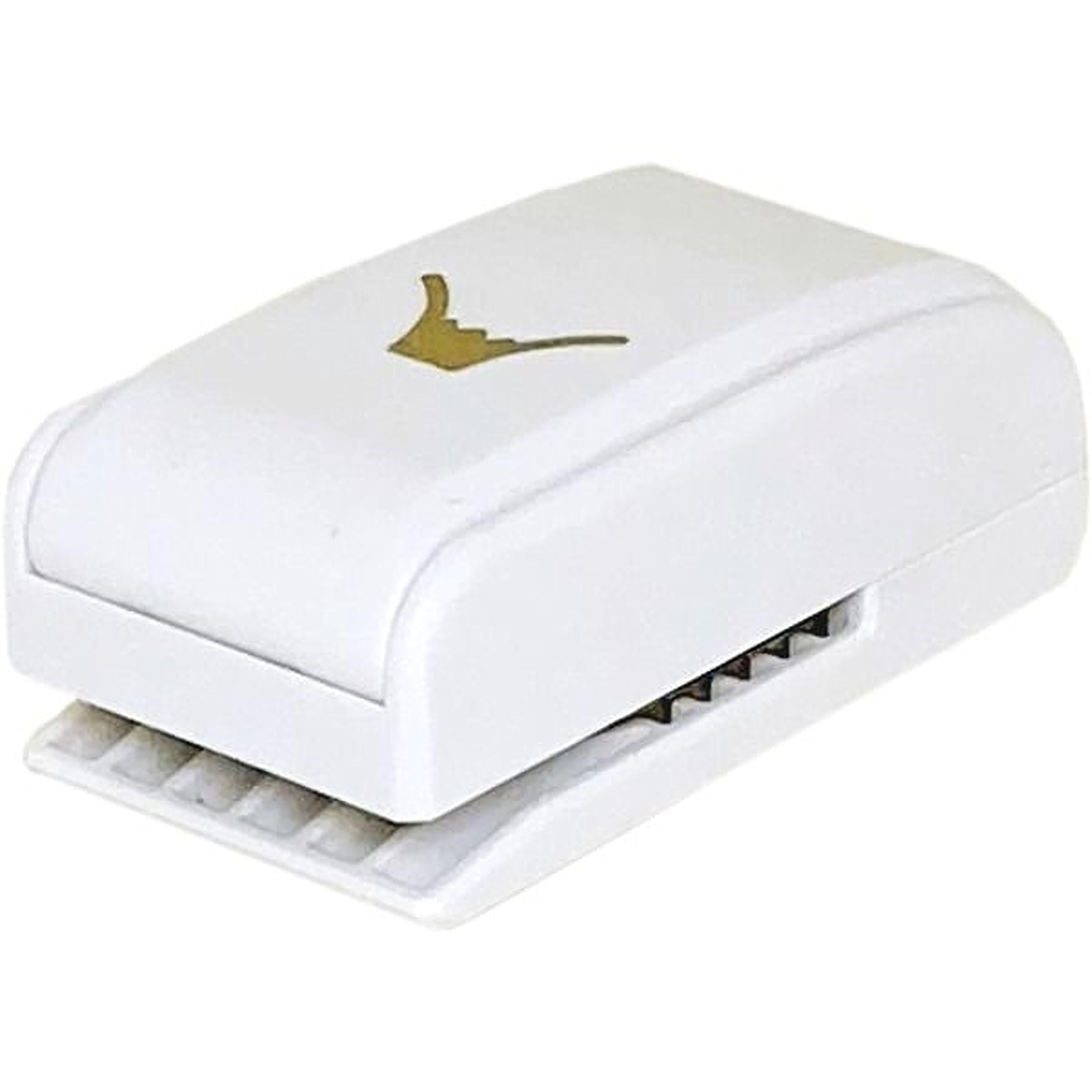 A white, rectangular hole puncher with a gold symbol on the top.
