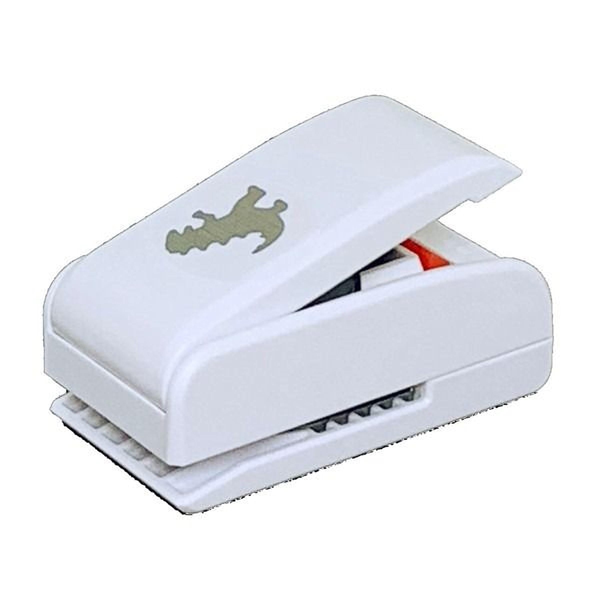 A white plastic hole puncher with a dinosaur design on it.