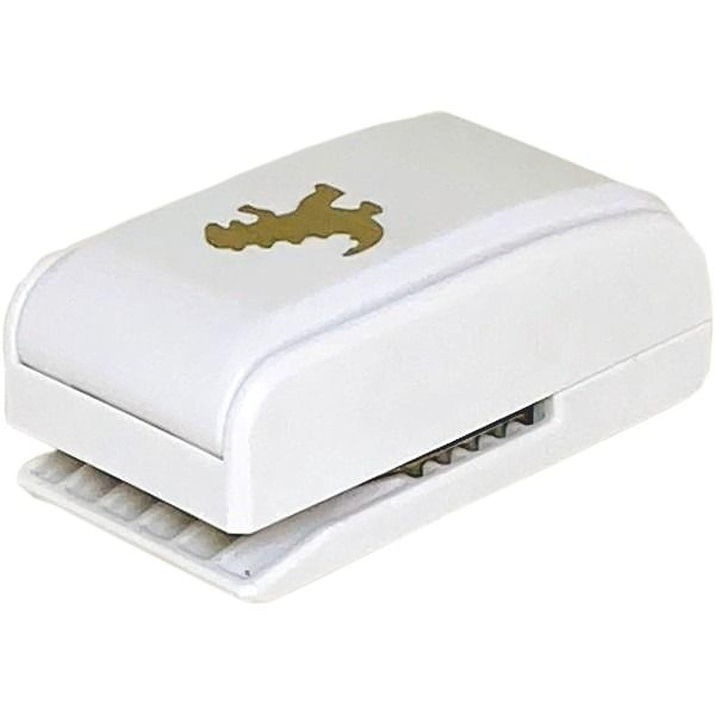 A white plastic stapler with a gold-colored animal design on the top surface.