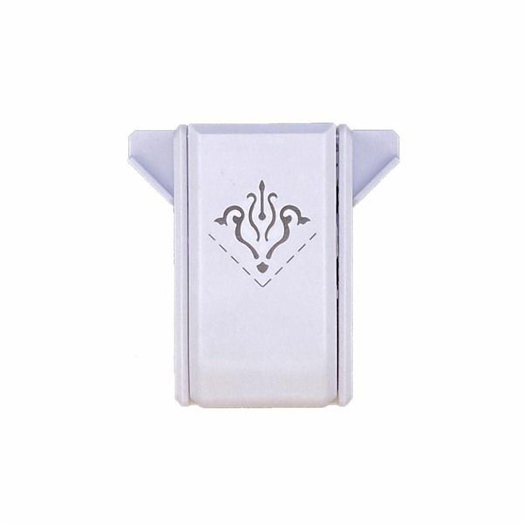A white rectangular object with a decorative design on it.