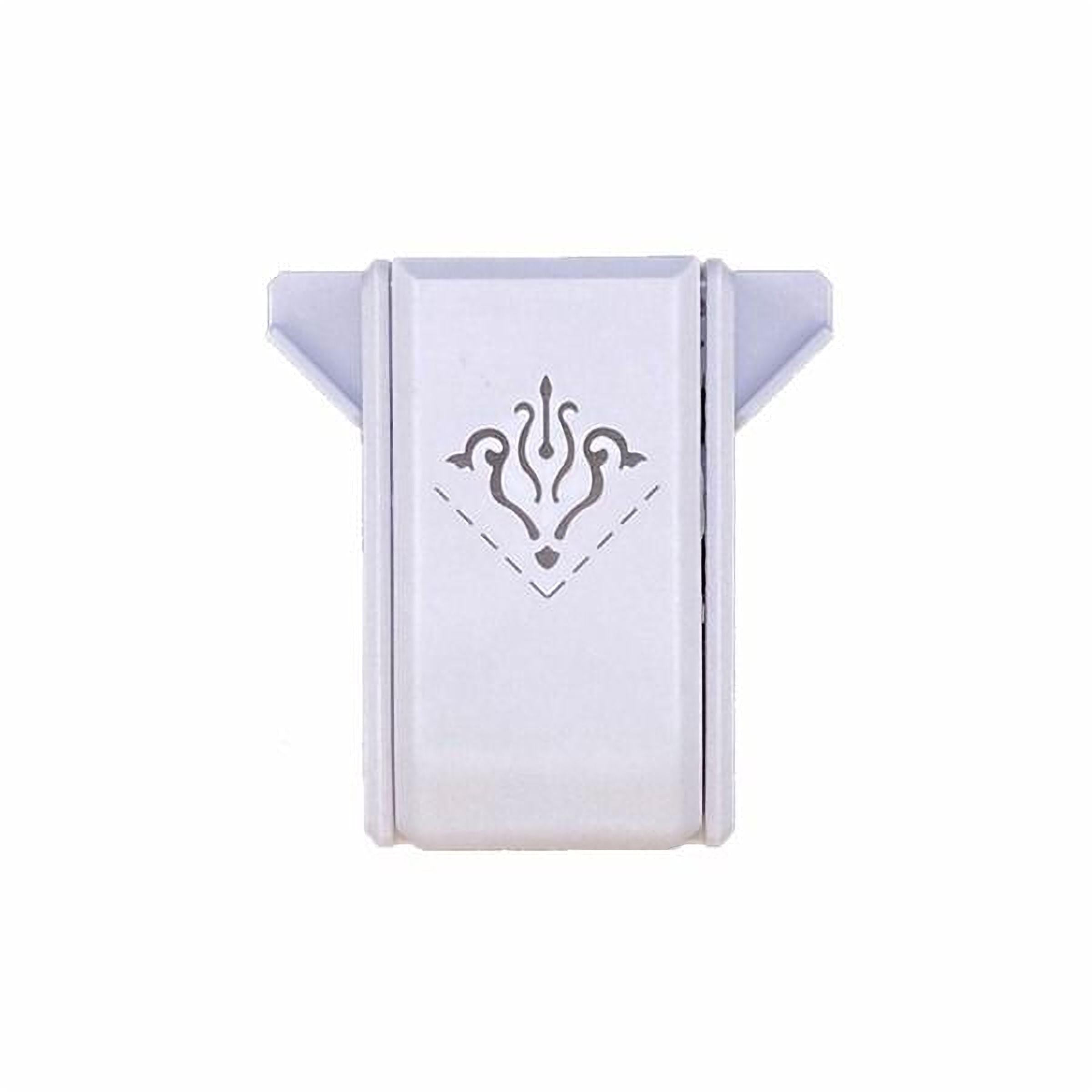 A white rectangular object with a decorative design on it.