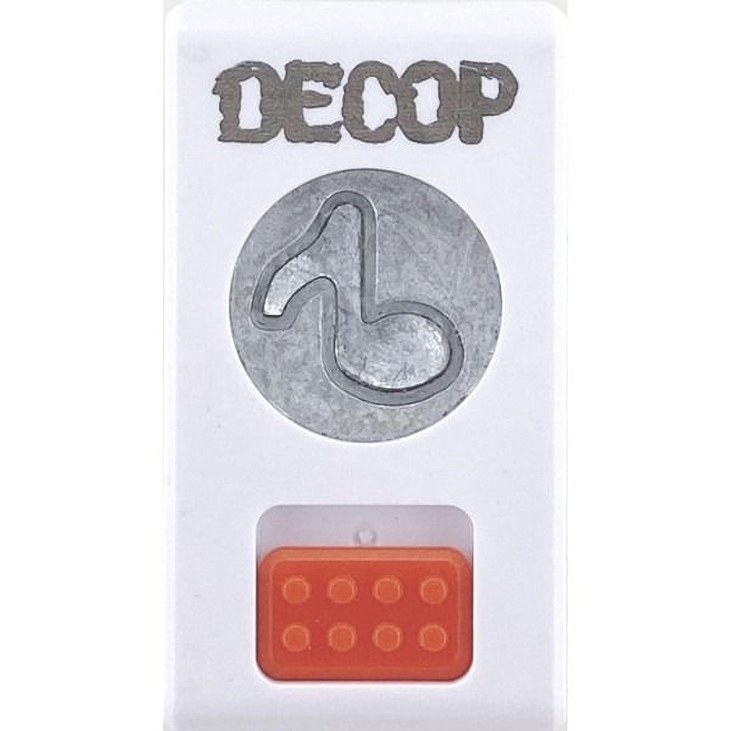a white object with the word "DECOP" written on it, along with a circular cutout of a musical note. Below the cutout, there is an orange object with a red square on it.