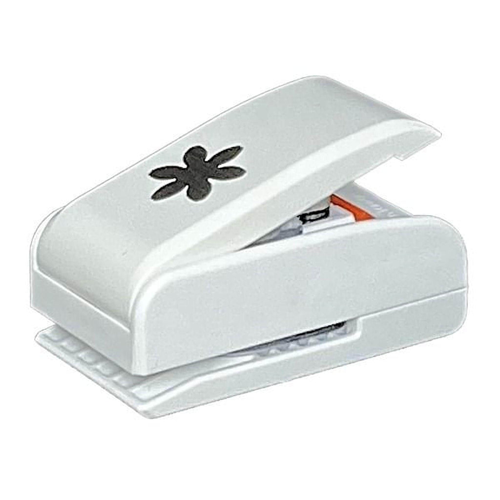 A white plastic hole puncher with a black flower design on the top.