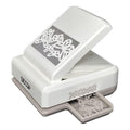 A white and gray decorative punch with a floral design on the front.