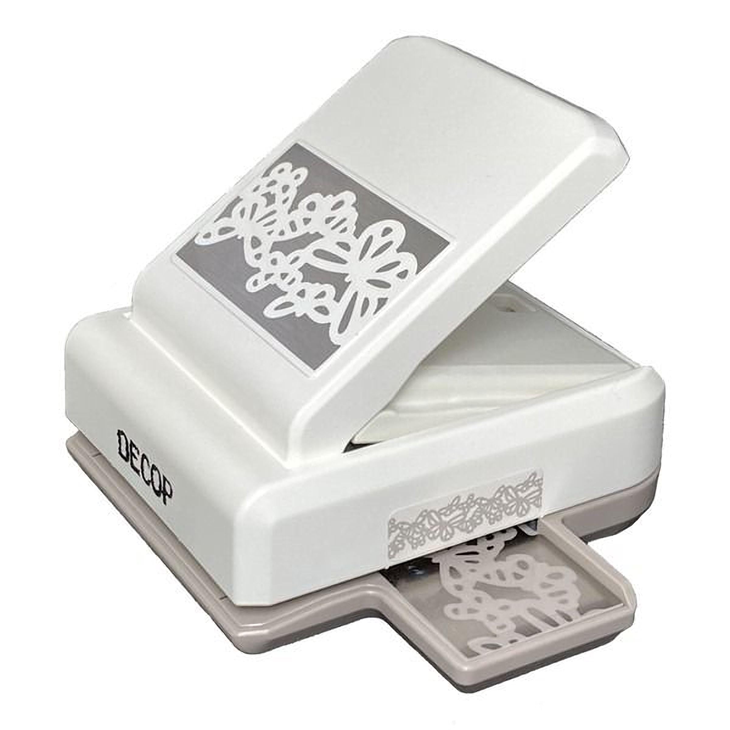 A white and gray decorative punch with a floral design on the front.