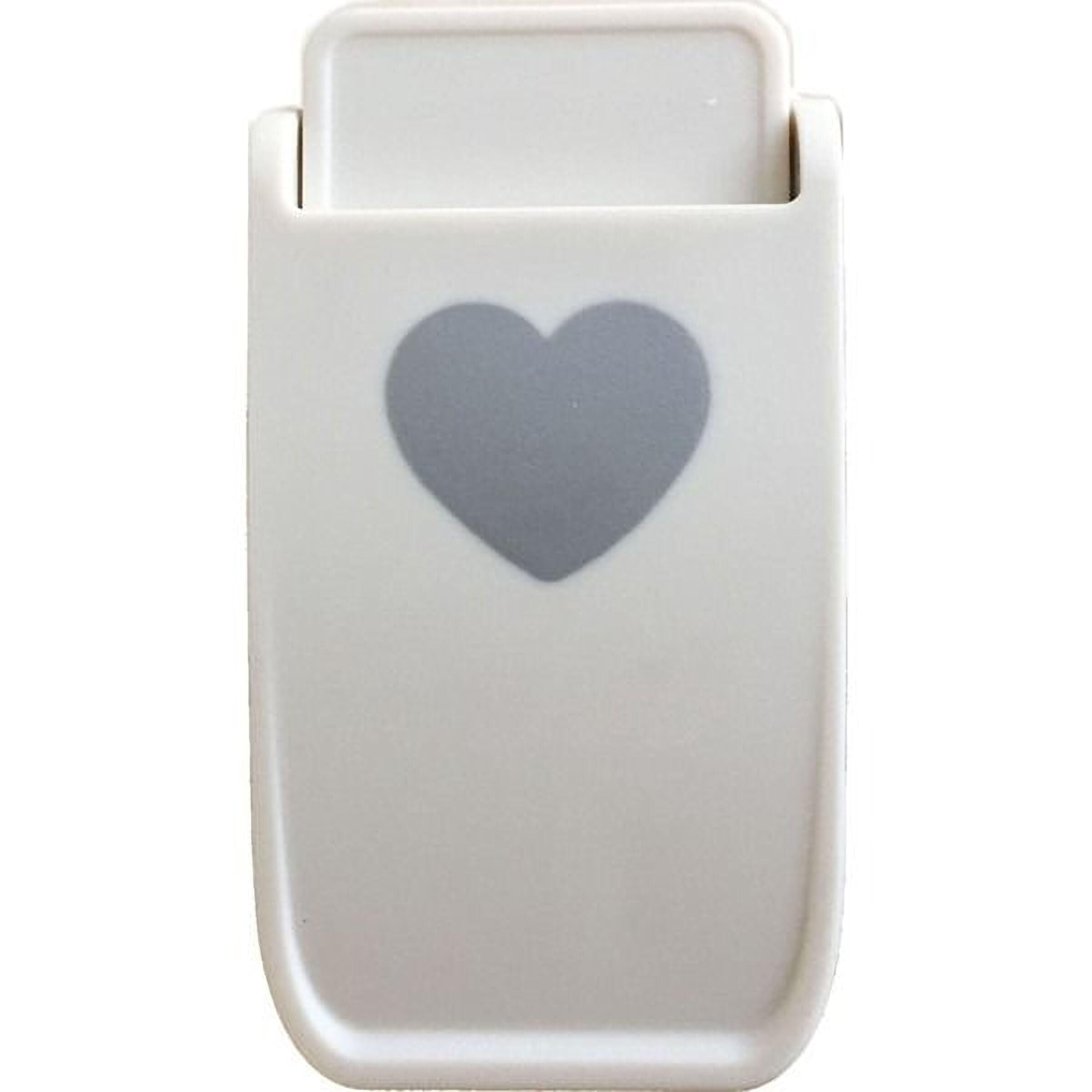 a white plastic object with a heart symbol on it.