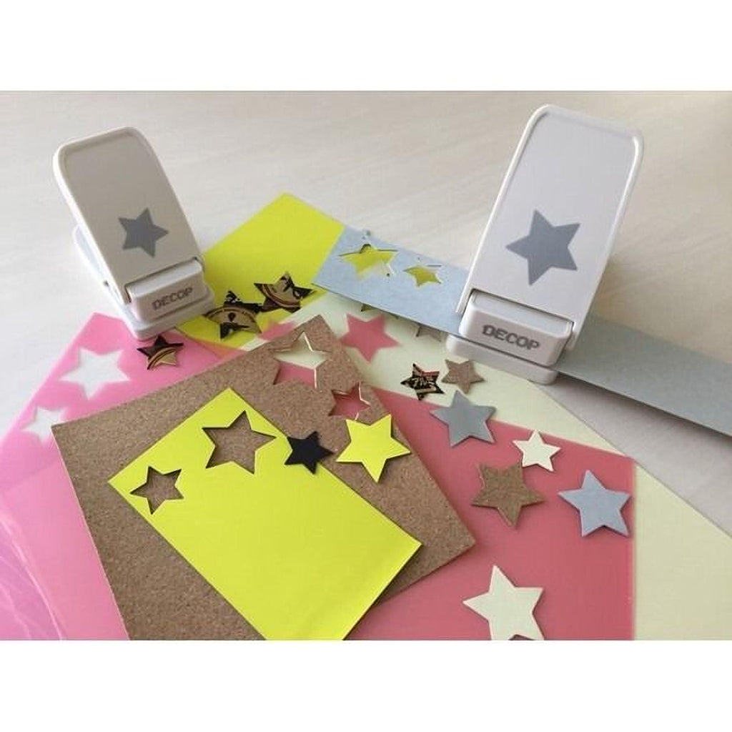 a collection of star-shaped cutouts and decorative elements, including star-shaped stickers and star-shaped cutouts, arranged on a surface.