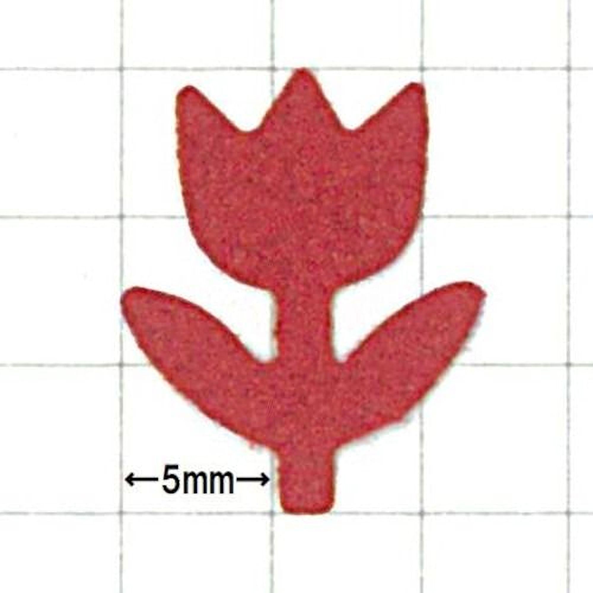 a red flower-shaped object with a grid background.