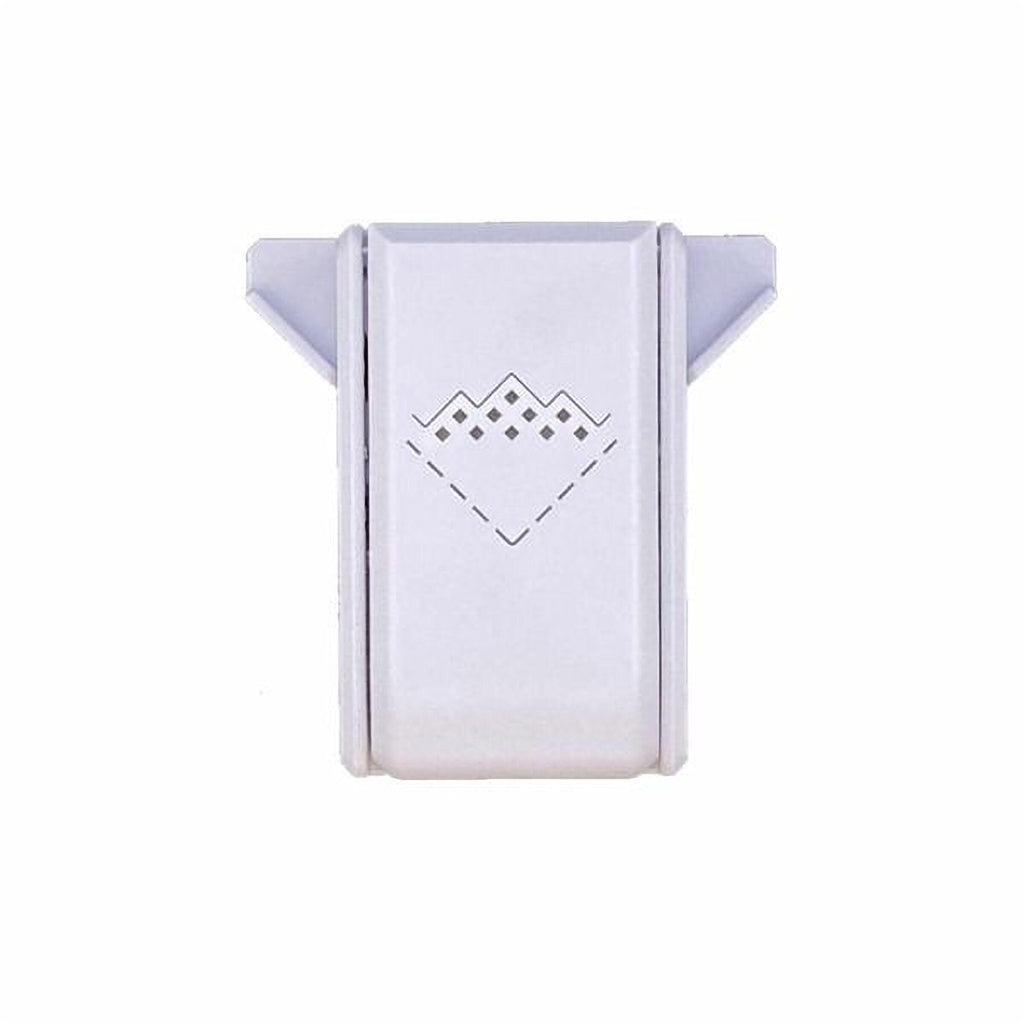 A white rectangular object with a diamond-shaped design on it.