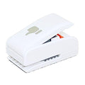 A white stapler with a thumb-like symbol on it.