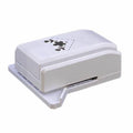 A white, rectangular, and flat-shaped object with a black design on it.