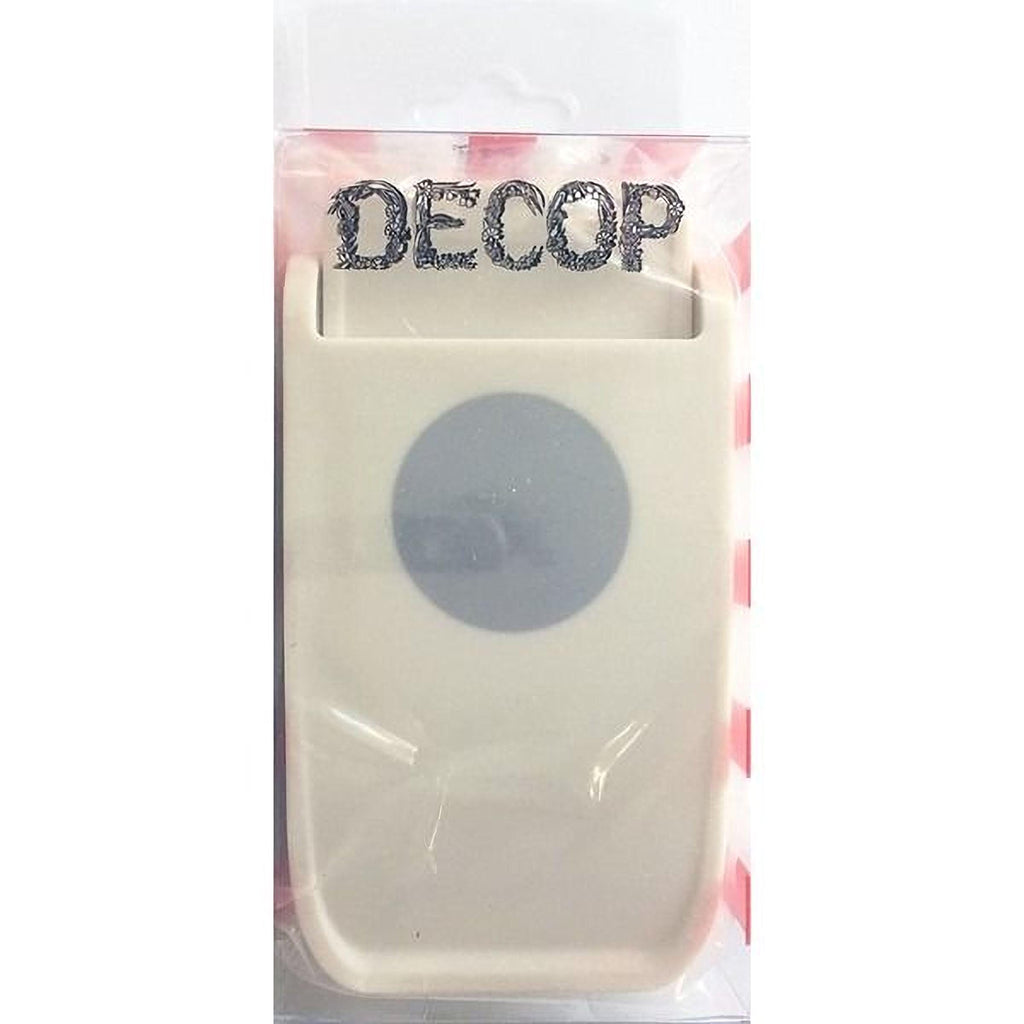 a white plastic object with a circular design on it, which appears to be a product packaging.