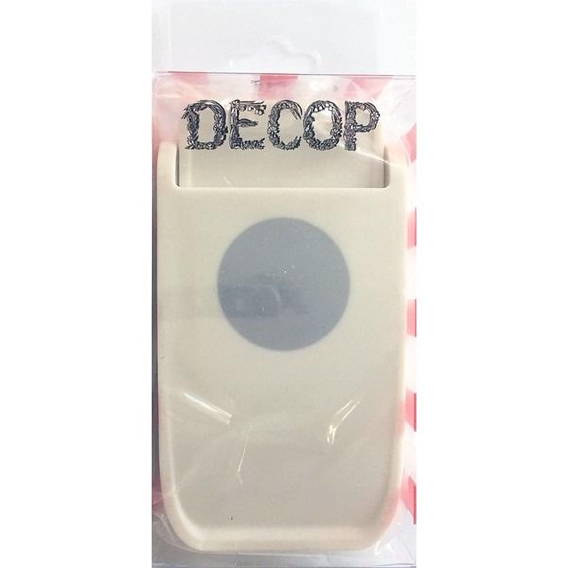 a white plastic object with a circular design on it, which appears to be a product packaging.