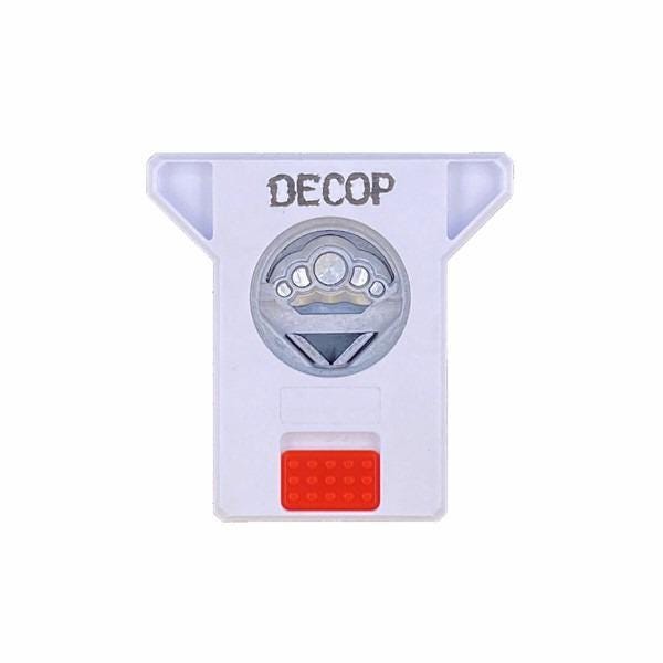 A white plastic object with a circular design and the word "DECOP" printed on it.