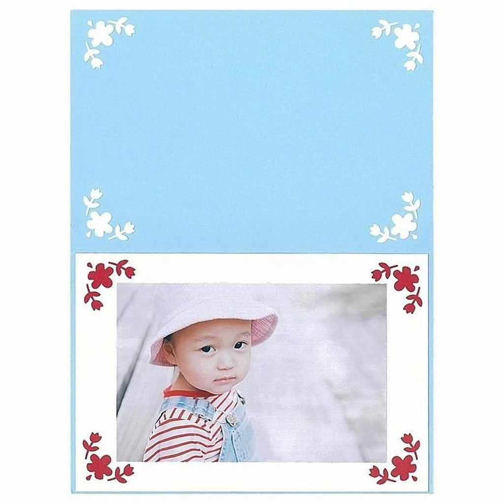 A young child wearing a white hat and striped shirt is the focus of the image, which is framed by a decorative border with red flowers.
