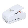 A white, rectangular hole puncher with a logo on it.