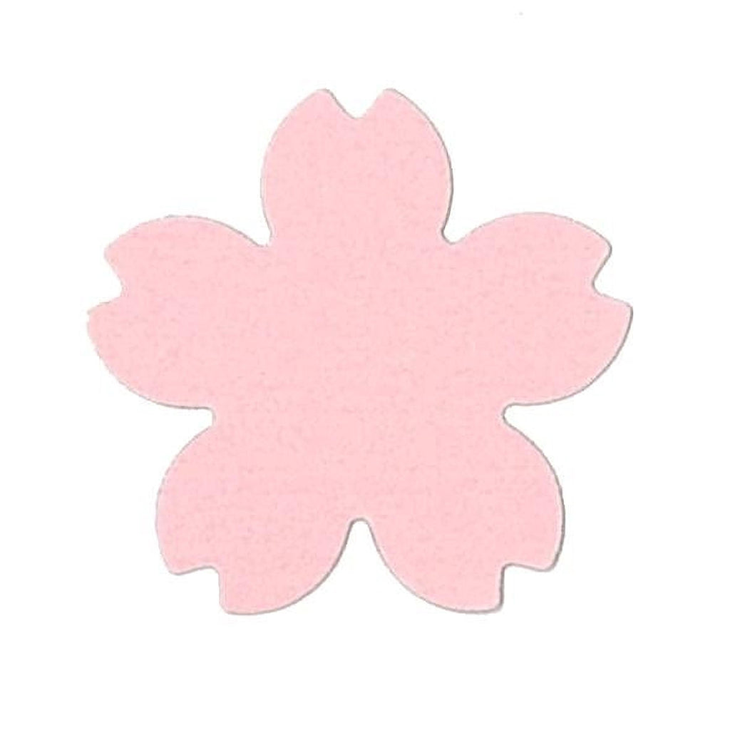 A pink paper flower shape against a white background.