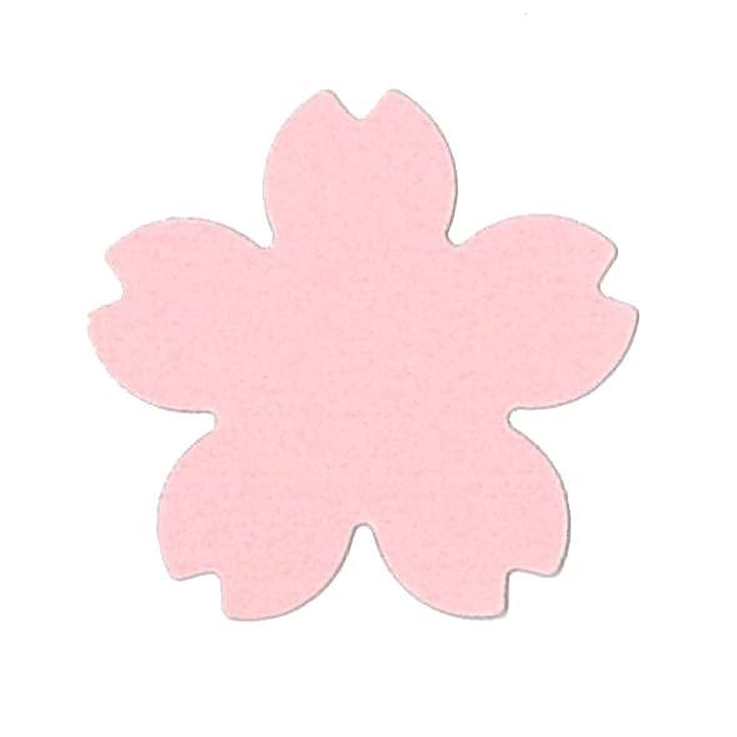 A pink paper flower shape against a white background.