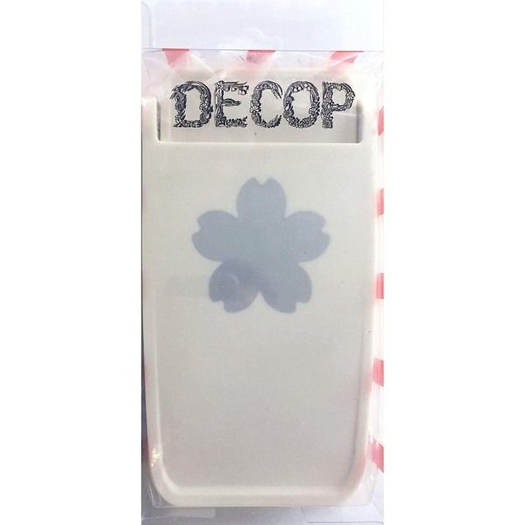 a white plastic container with a blue flower design on it.