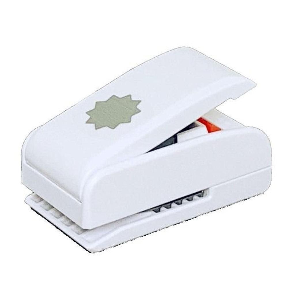 A white plastic hole puncher with a star-shaped design on the top.