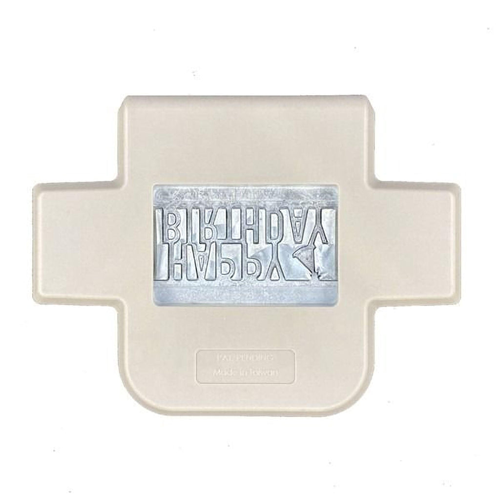 a white plastic object with a silver-colored design on it.