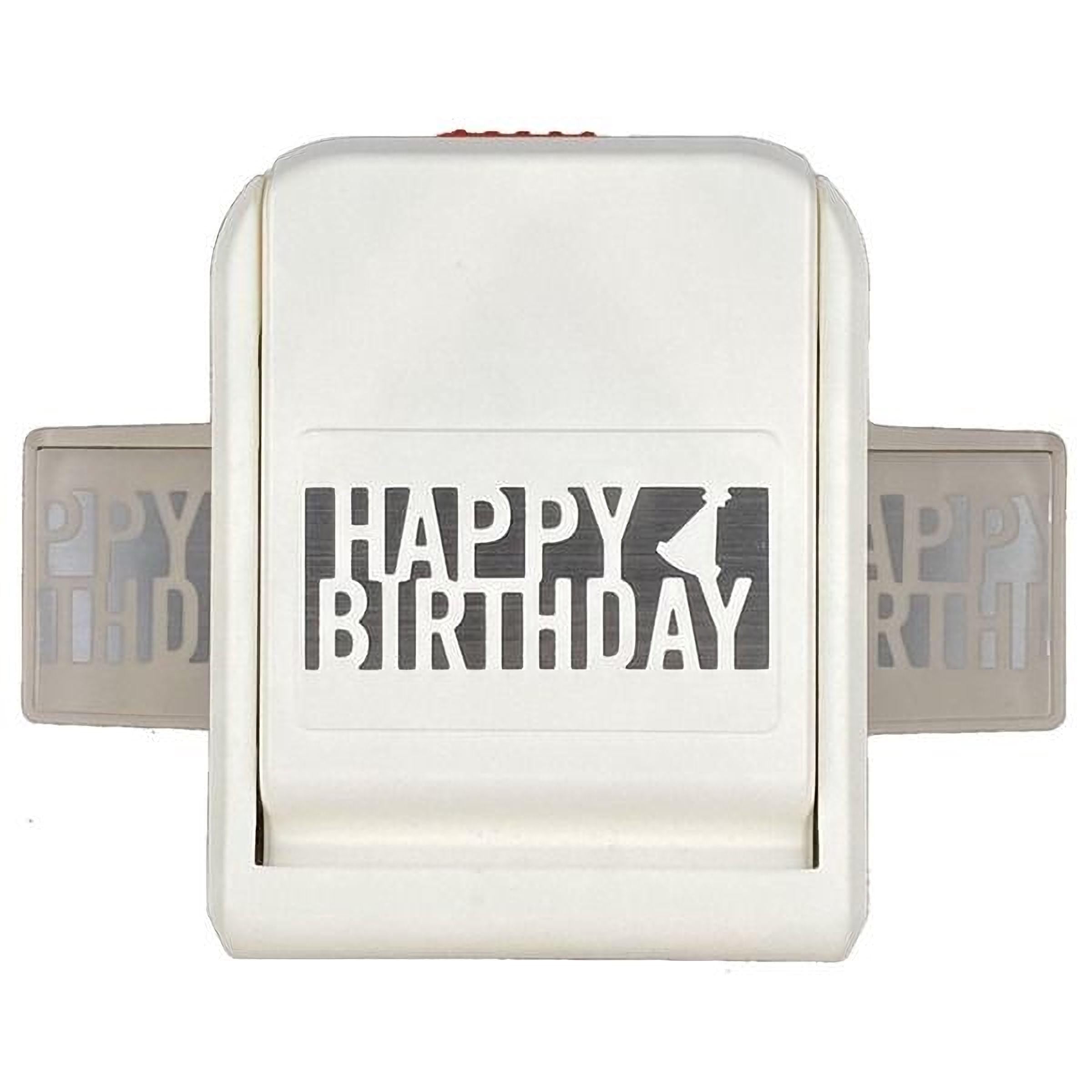 A white birthday card punch with the text "HAPPY BIRTHDAY" printed on it.