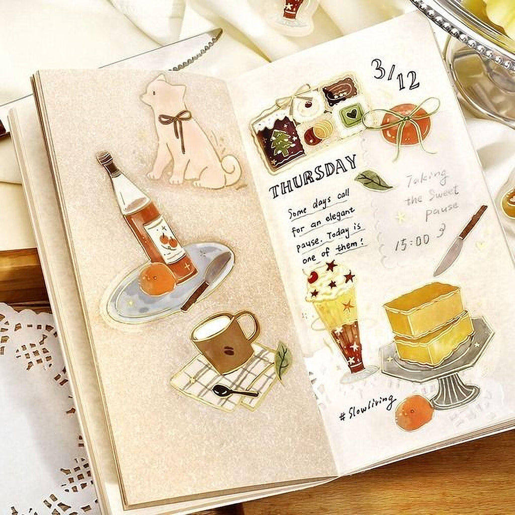 The image is a page from a notebook featuring illustrations and notes about food and beverages, including a dog, a bottle, a cup, and a cake.