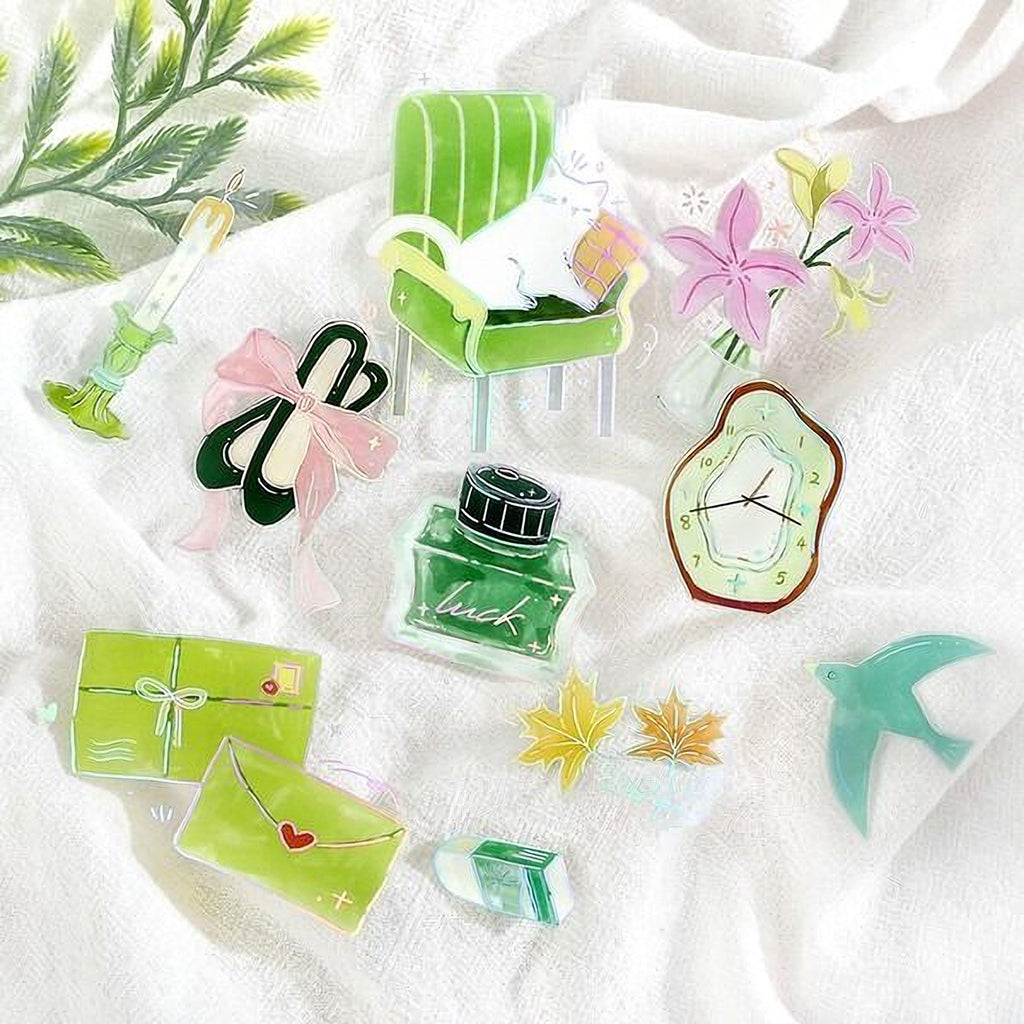 various colorful and whimsical objects, including a green chair, flowers, a clock, a bird, and a green envelope.