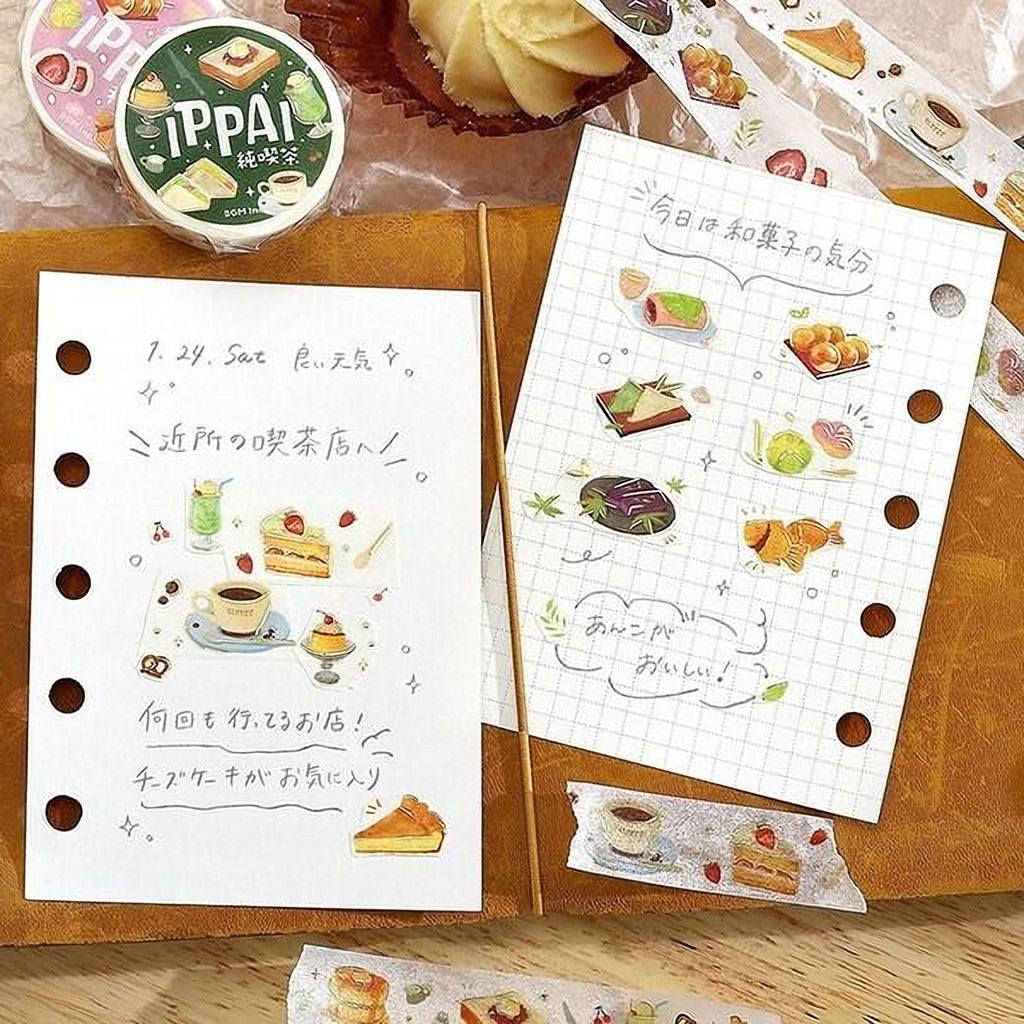 a collection of food-related items, including a notebook with a page of illustrations, a sheet of paper with various food items, and a container of Tippai brand stickers.