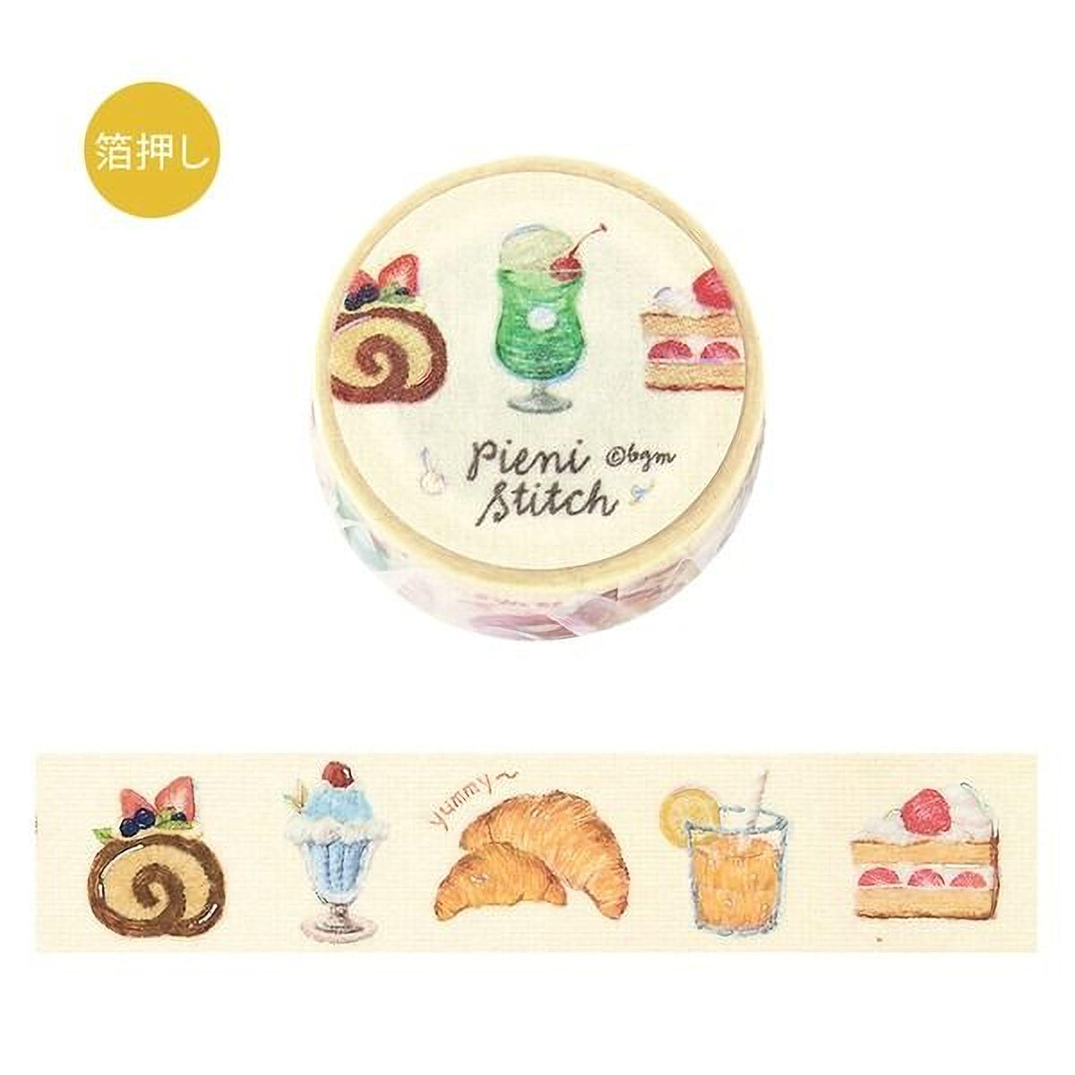 a round, decorative object with various food items and drinks printed on it, including a green drink, a slice of cake, a croissant, a strawberry shortcake, a milkshake, and a lemonade.