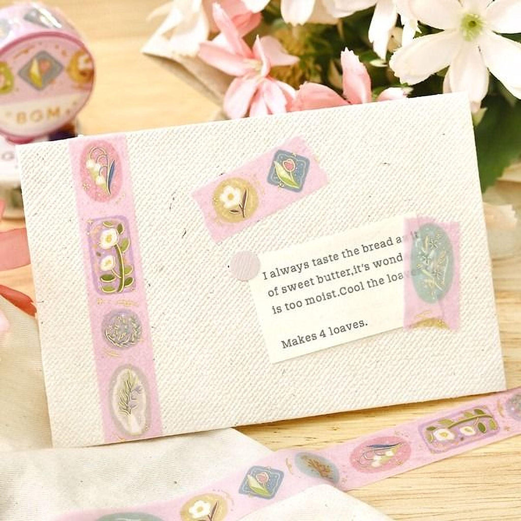 a card with a message and decorative elements, such as a pink floral border and a pink and white floral pattern.