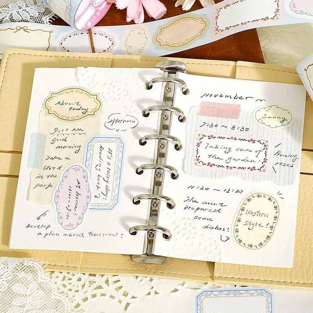 an open notebook with handwritten notes and various stickers, including floral and decorative elements, scattered across its pages.