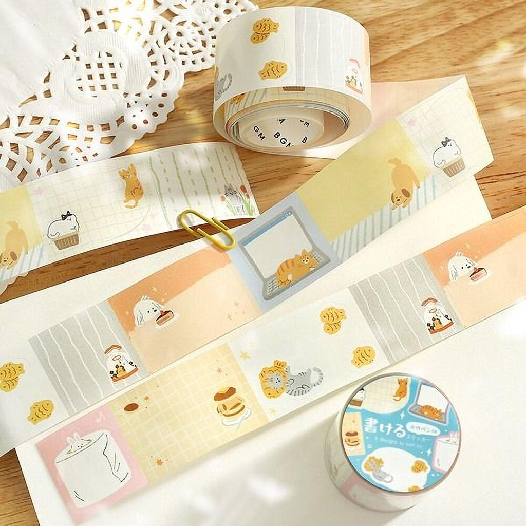 a collection of colorful and whimsical cat-themed stickers and washi tape arranged on a wooden surface.