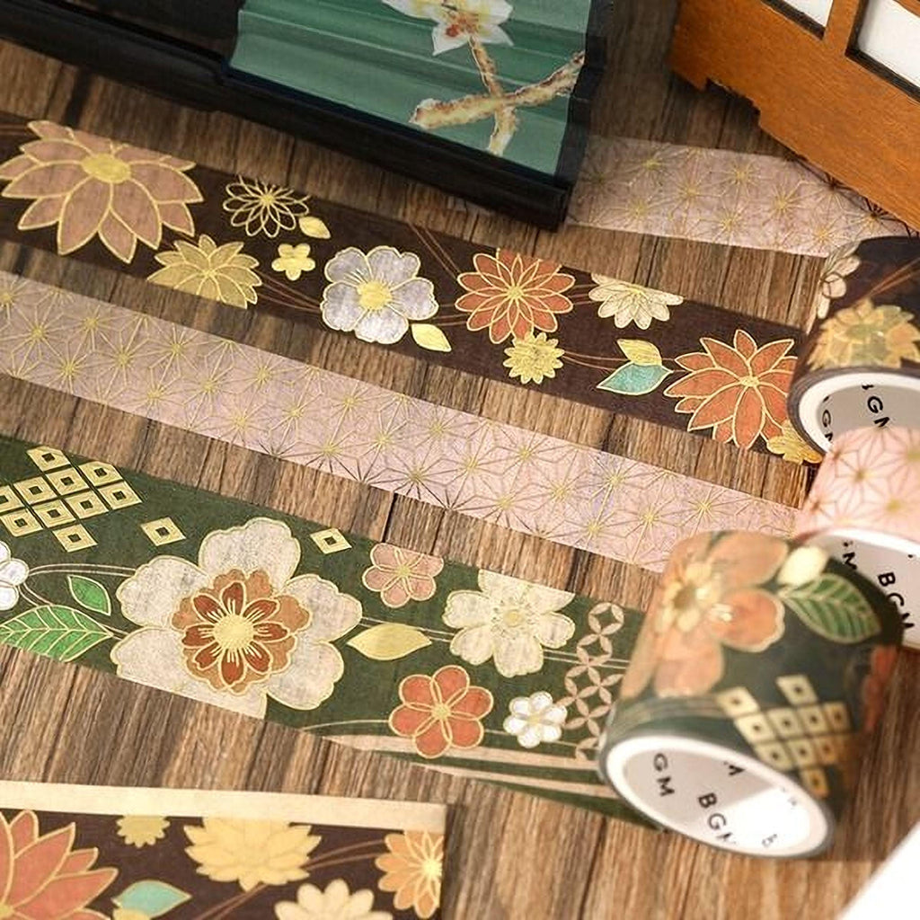 a collection of decorative floral and geometric patterns on various surfaces, including a wooden table and a wooden box.