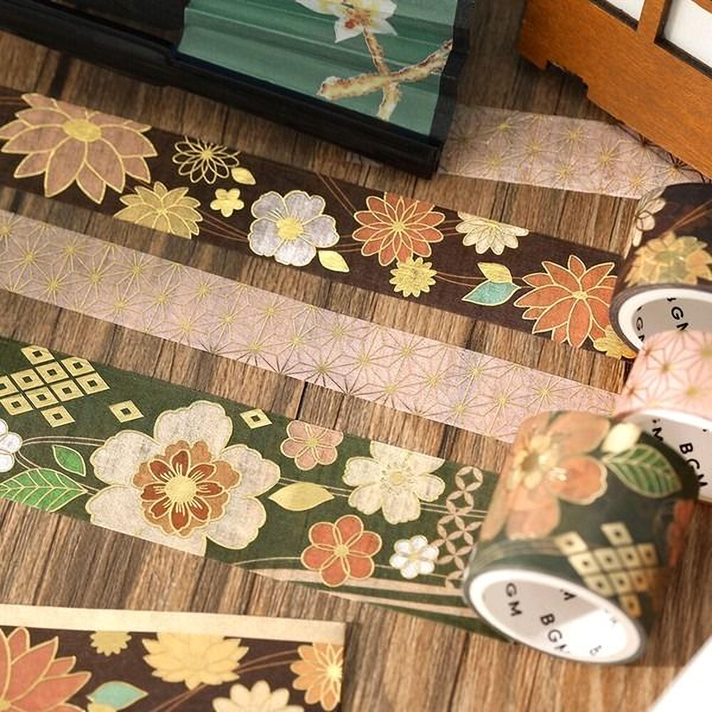 a collection of decorative floral and geometric patterns on various surfaces, including a wooden table and a wooden box.